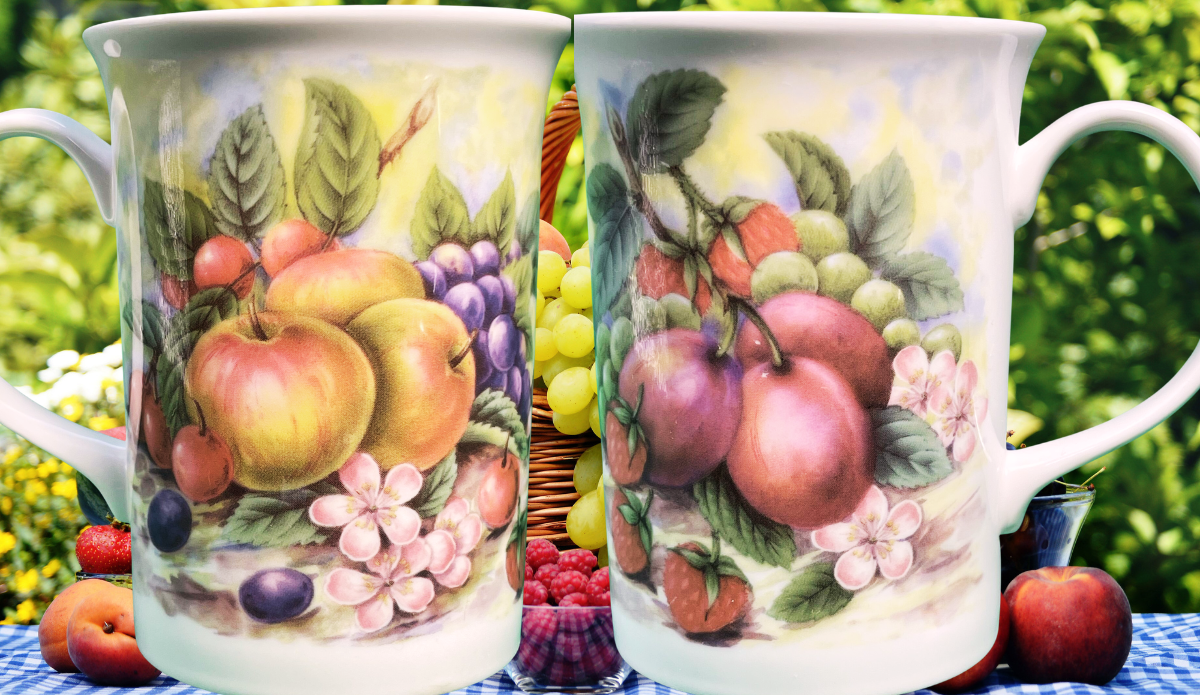 Churchill Fruit and Flower Mug displayed in an outdoor fruit and garden picnic setting