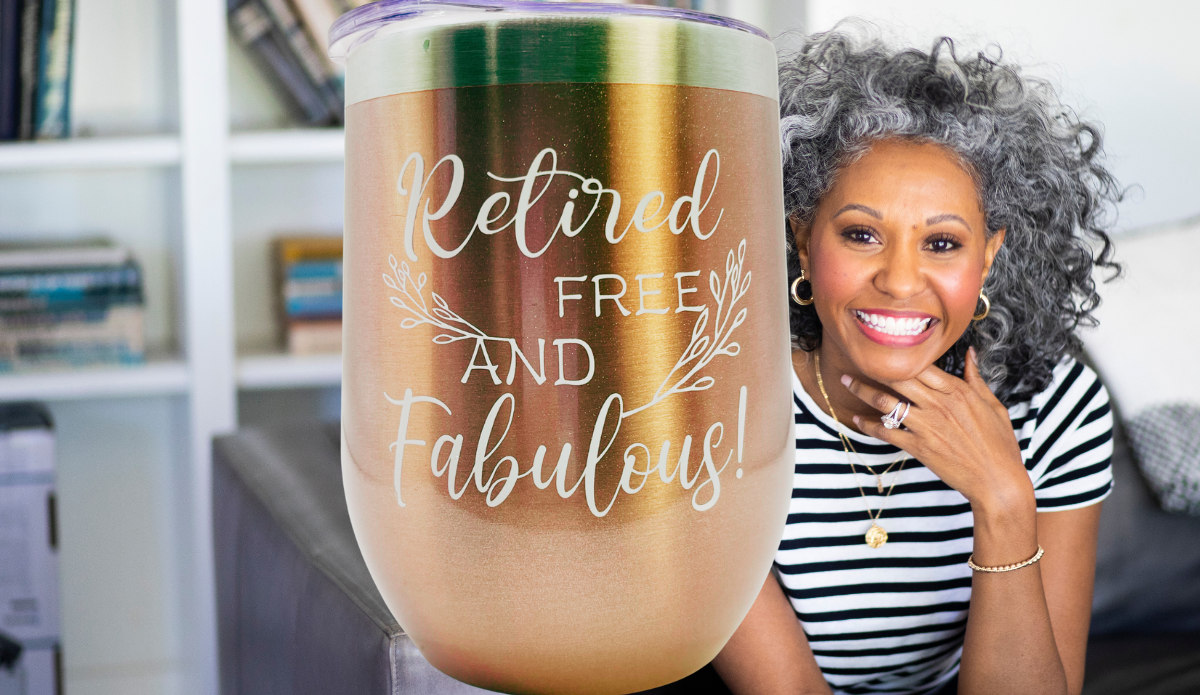 Retired Free And Fabulous rose gold wine tumbler displayed with smiling retiree