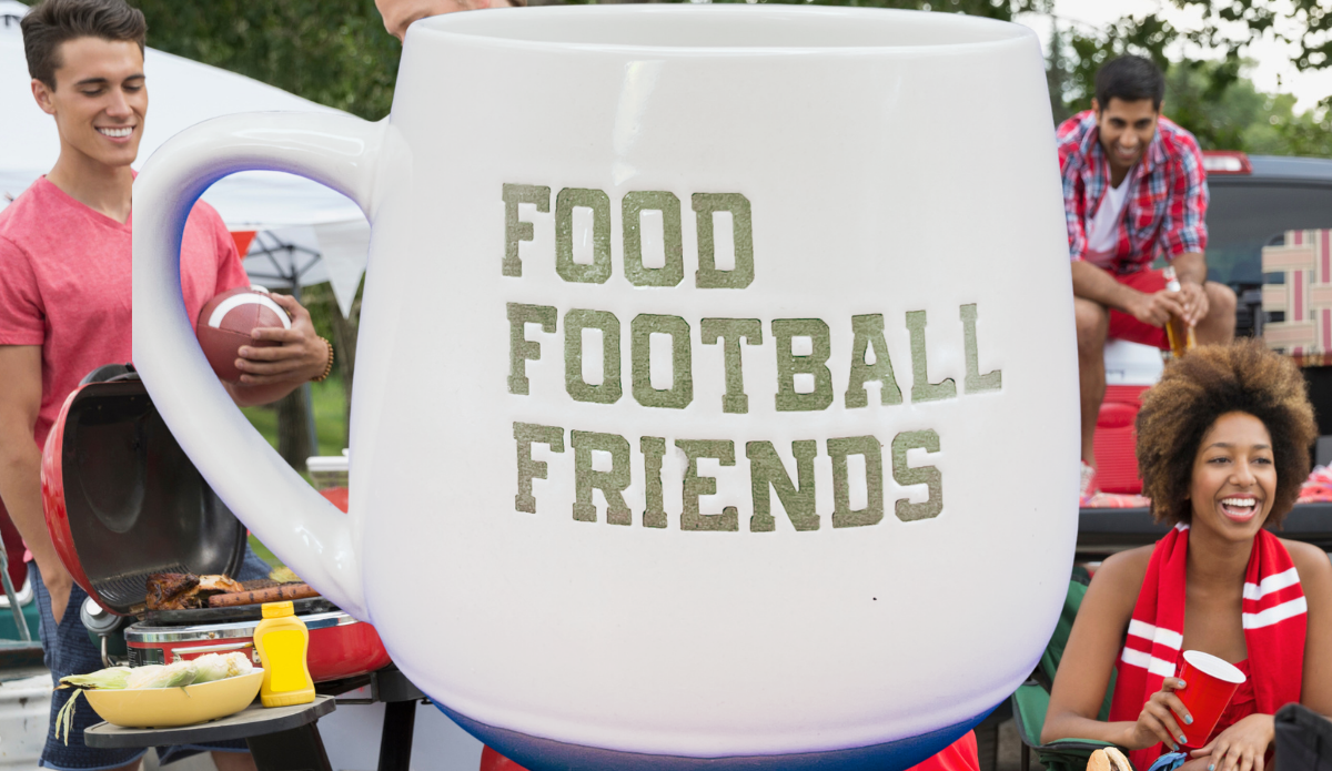 Food Football Friends Game Day mug displayed at a football tailgate gathering
