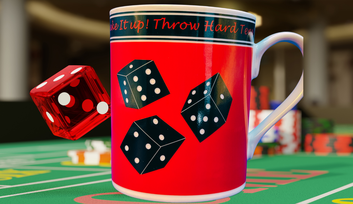 Godinger Craps Dice Coffee Mug displayed on a green casino gaming table beside a translucent red die and colorful gaming chips.