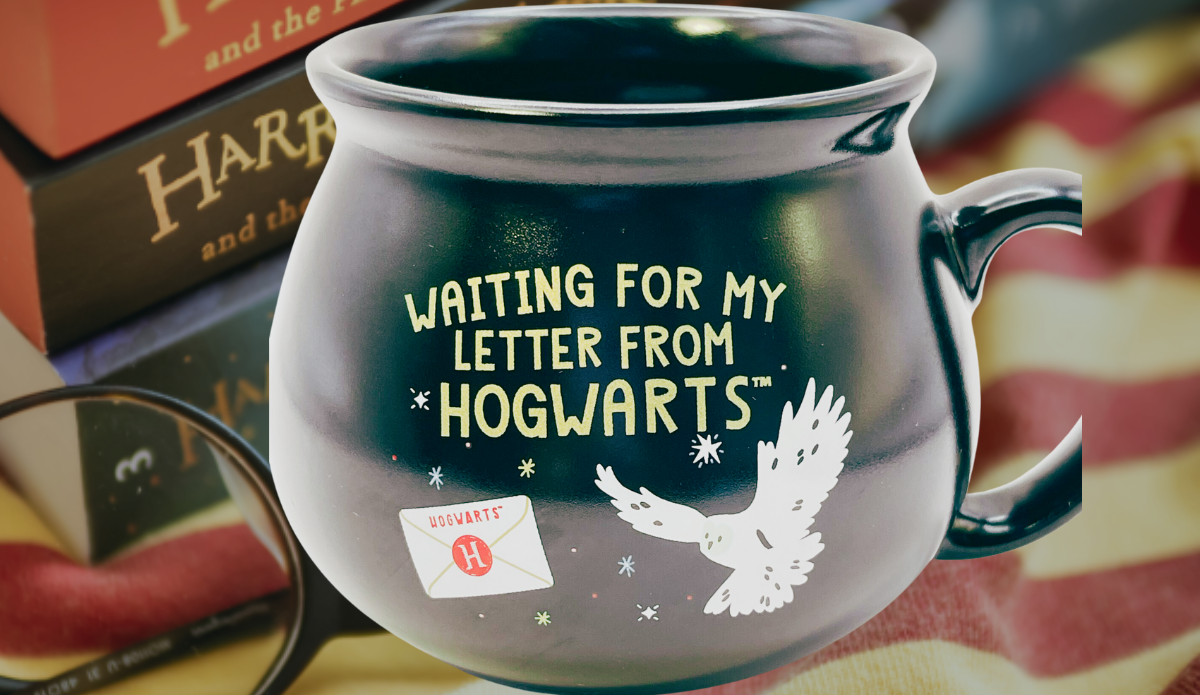 Harry Potter Hogwarts Letter Cauldron Mug displayed with Harry Potter books and reading glasses