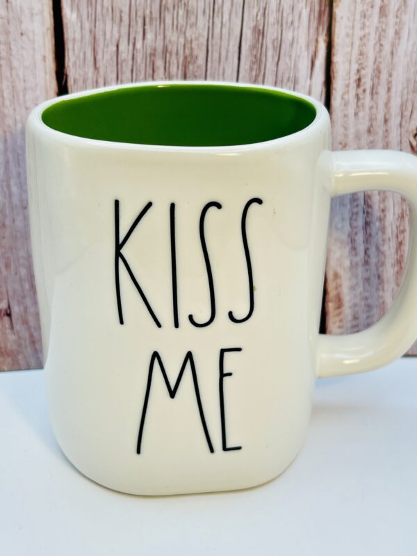 Rae Dunn Kiss Me Mug with embossed green lettering