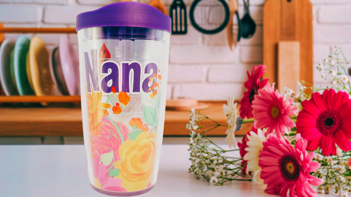 Tervis Nana floral tumbler displayed in kitchen setting with colorful flowers beside insulated tumbler