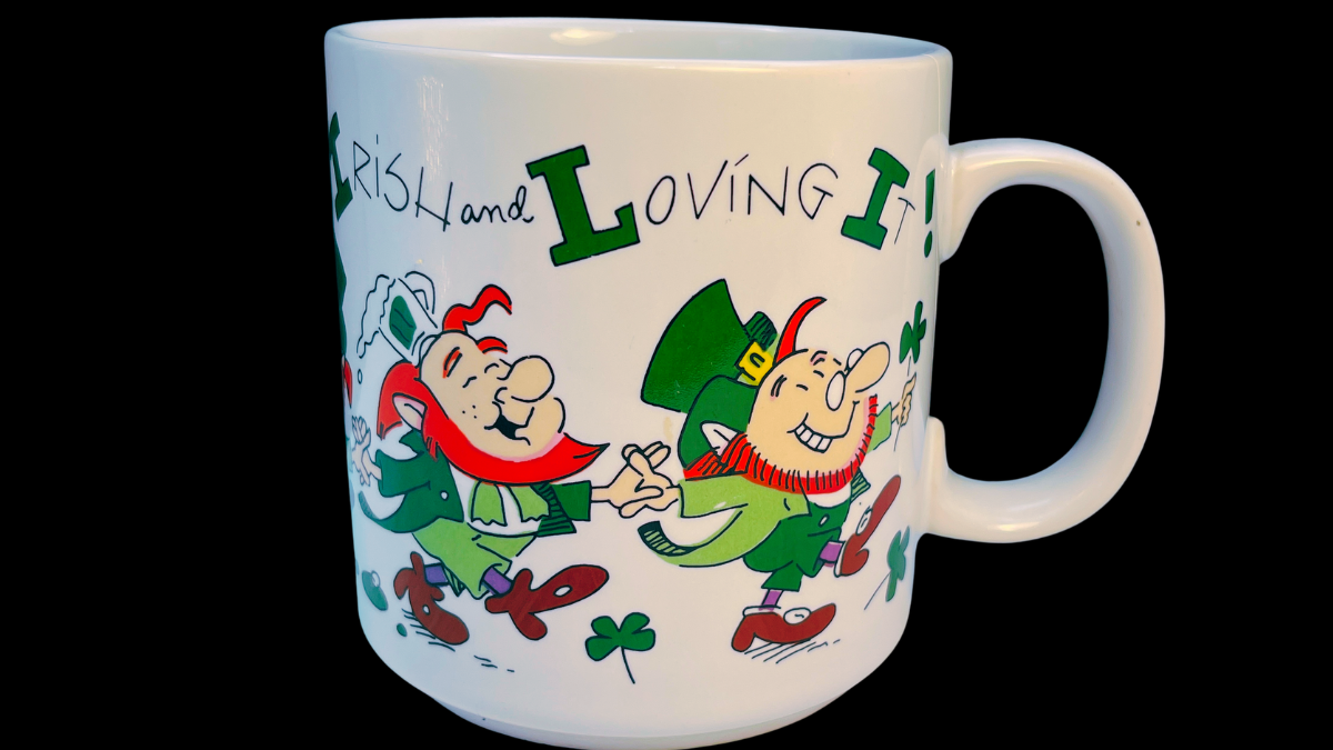 Russ Berrie Irish and Loving It leprechaun mug with dancing cartoon leprechauns and green shamrocks