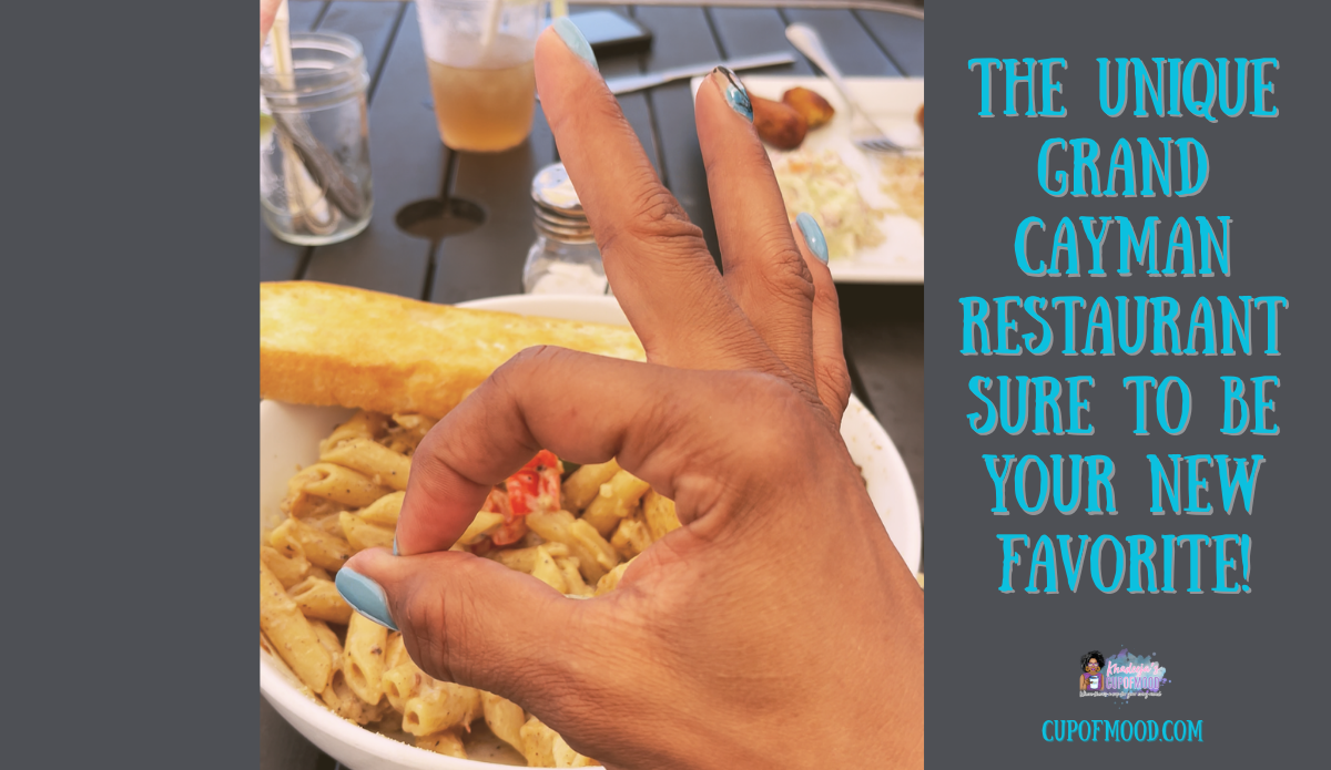 enjoying Rasta pasta at Grand Cayman waterfront restaurant near cruise port