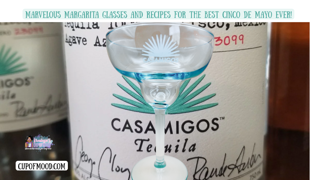 Casamigos tequila aqua rim margarita glass with etched agave logo displayed in front of tequila bottle for Cinco De Mayo margarita glasses blog