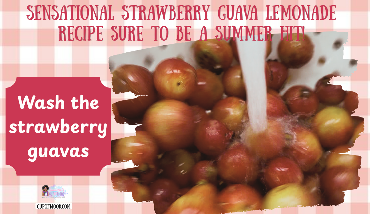 Strawberry guavas being washed under running water for the CupofMood Strawberry Guava Lemonade recipe.