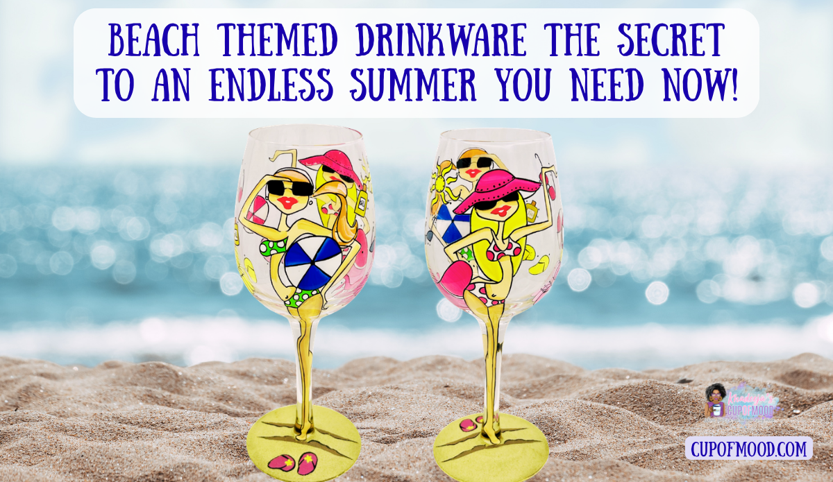 Colorful beach lady wine glass displayed in the sand with sparkling ocean water behind them