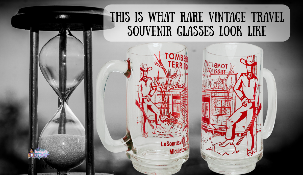 Two clear Tombstone Territory souvenir mugs with red Western artwork beside an hourglass in a black-and-white scene.