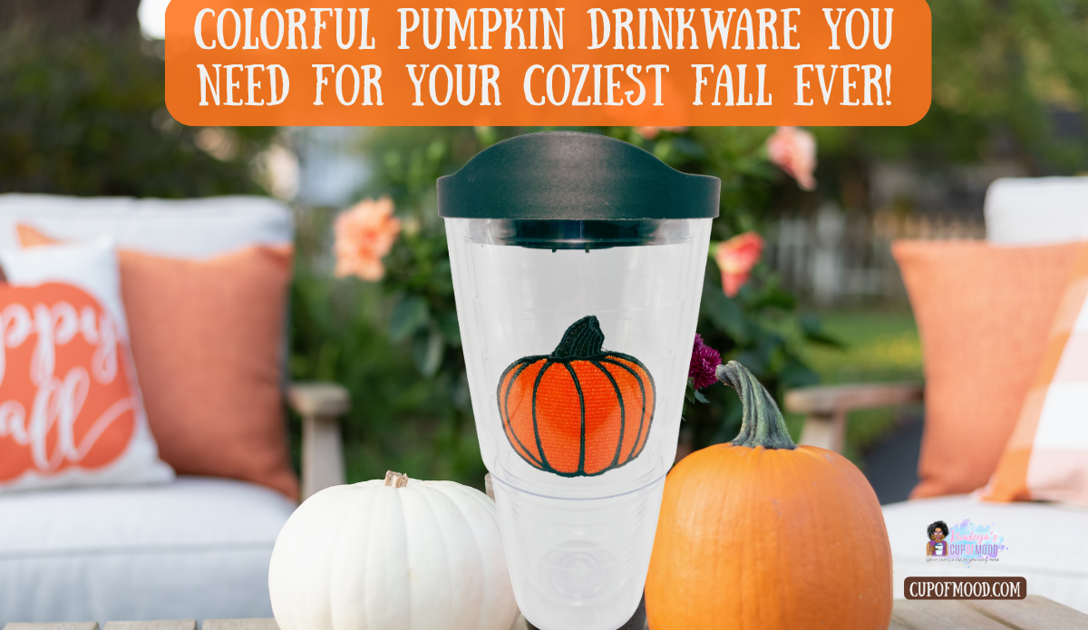 Tervis pumpkin double wall insulated tumbler with orange pumpkin design displayed outside with white and orange pumpkins