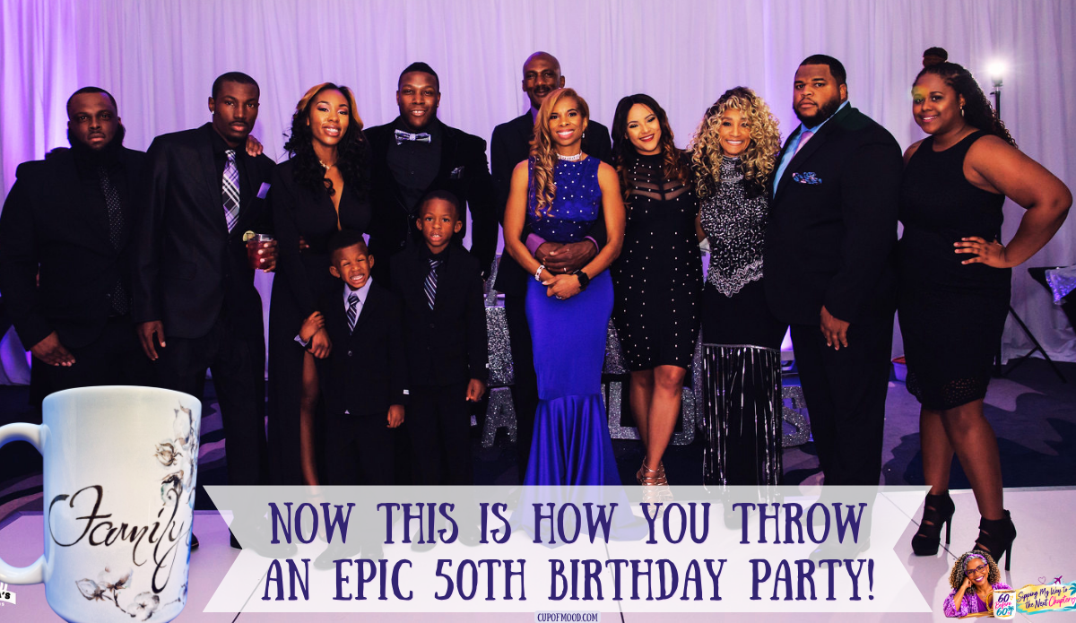 Khadeeja in her purple birthday gown posing with a large group of family members dressed in black, accompanied by a white Family mug with floral artwork.