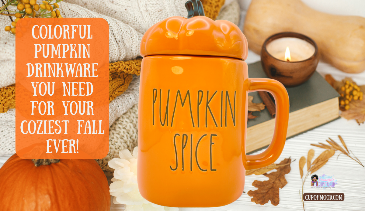 Orange Rae Dunn Pumpkin Spice mug with pumpkin topper lid displayed with pumpkins candle and cozy fall blankets