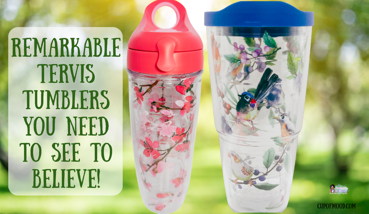 Tervis Japanese Cherry Blossom water bottle and Watercolor Songbirds tumbler displayed against a softly blurred green garden background.