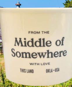 Middle of Somewhere Oklahoma mug with rustic barn and countryside background