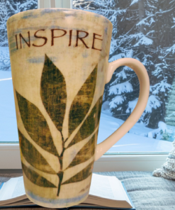 inspire latte mug styled in cozy setting with natural light and calm decor