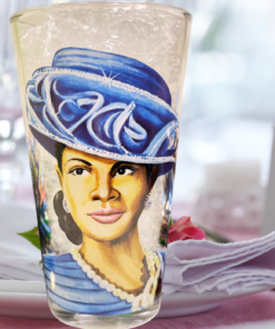 Royal Blue Hat Church Lady Glass displayed beside pink flowers and elegant decor