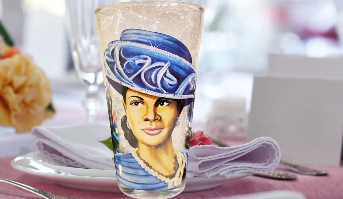 Royal Blue Hat Church Lady Glass displayed beside pink flowers and elegant decor