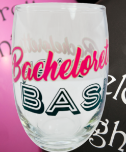 Bachelorette Bash Stemless Wine Glass displayed with bachelorette party decorations