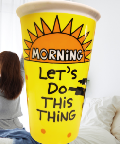 Morning Karate Tumbler in a bright bedroom scene with a woman stretching beside the motivational design
