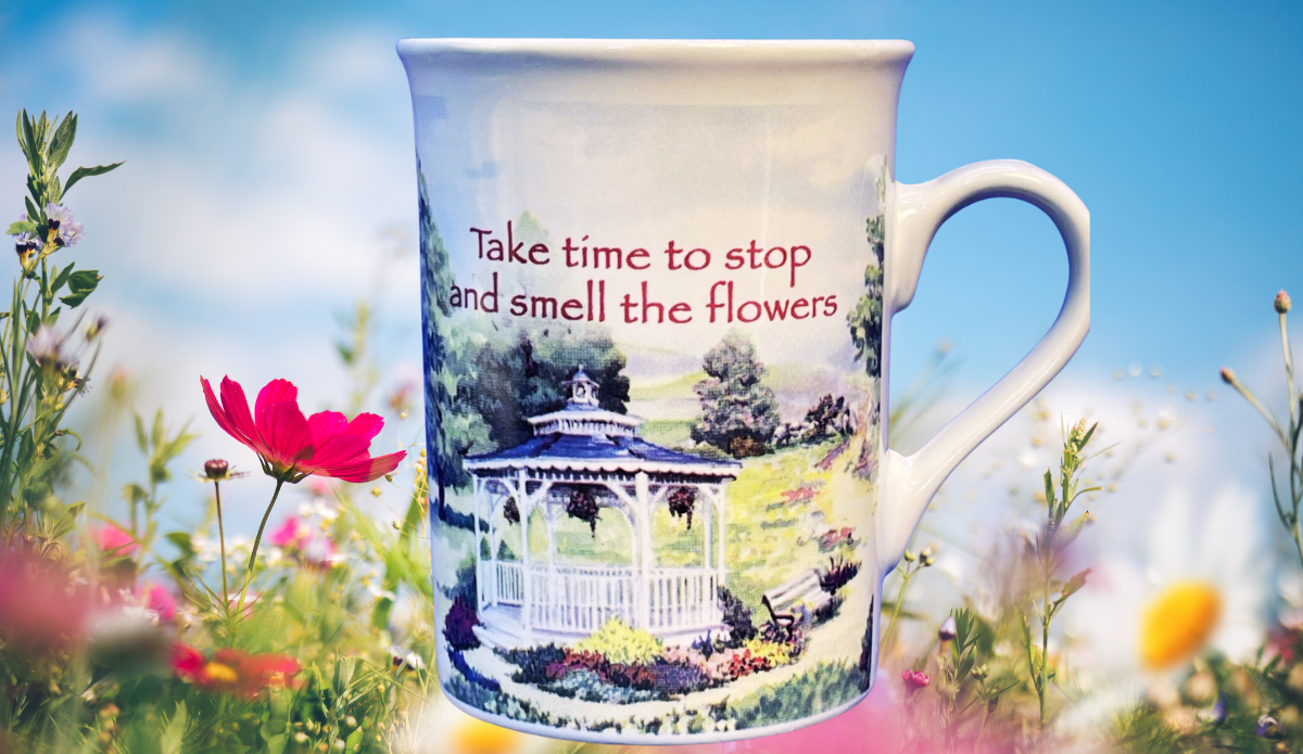 Chicken Soup for the Soul Floral Gazebo Mug styled in a bright floral setting with soft natural light