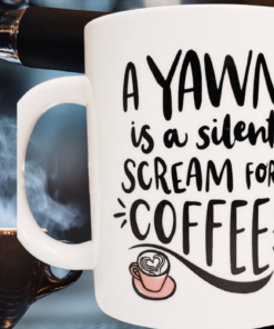 Silent Scream For Coffee Mug displayed beside an espresso machine pouring fresh coffee