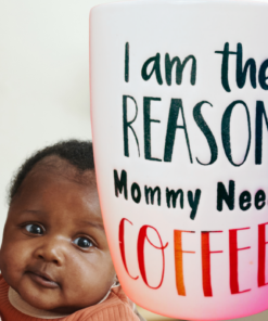 I Am The Reason Mommy Needs Coffee Mug lifestyle scene mom holding baby coffee moment