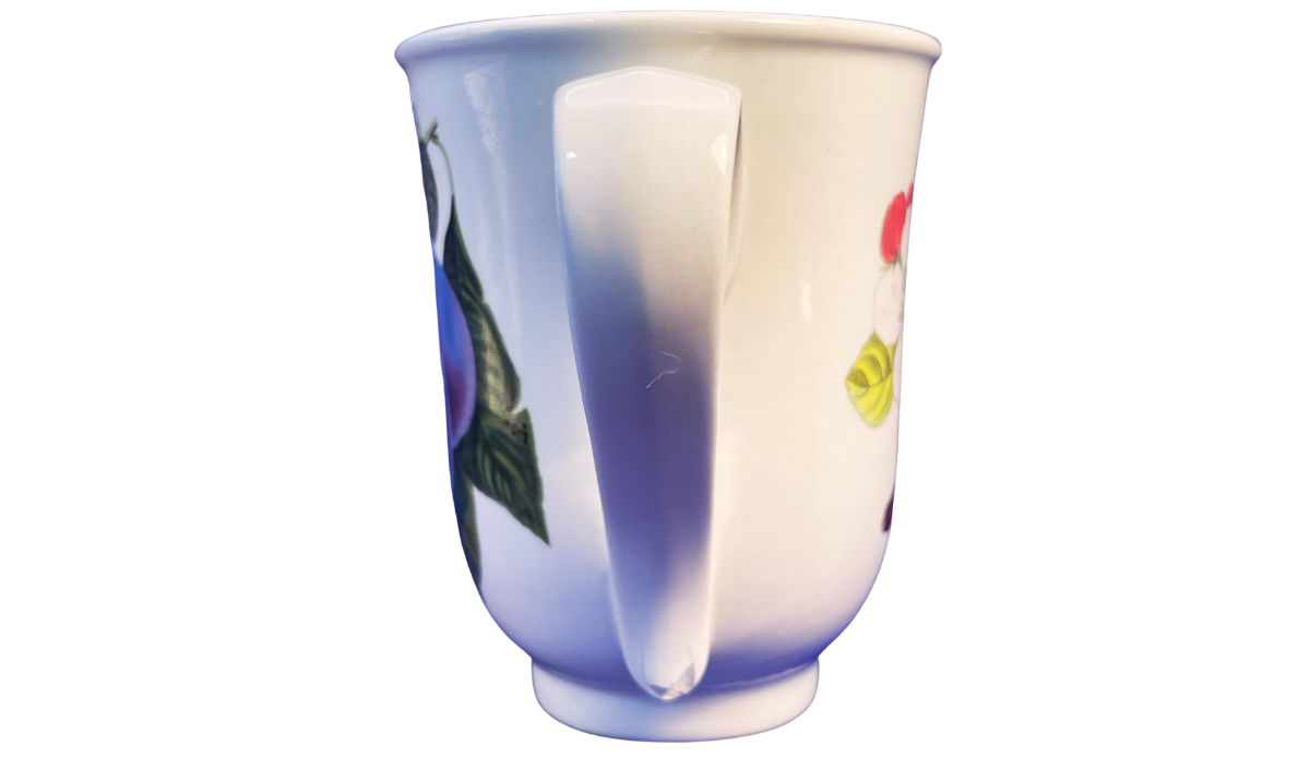 Handle view of the Portmeirion Pomona plum mug with a tall white curved handle