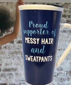 Messy Hair and Sweatpants Mug displayed beside a smiling woman in sweatpants with natural hair in a relaxed casual setting.