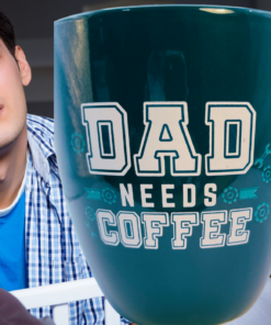Oversized Dad Needs Coffee Mug beside a tired dad standing over a baby crib