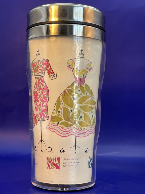 Elevate your daily caffeine fix with our Fashion Dresses Travel Mug from the Fashionista Collection! It’s the perfect #cupofmood to stay chic and caffeinated on the move.In fact, crafted with both functionality and flair in mind. This 12-ounce double wall insulated stainless steel mug is designed to keep your beverages hot.While you stay chic on the go.