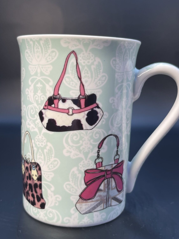 All around this unique Kent Pottery Coffee Cup with Multicolor Handbags will definitely please the purse, handbag and fashion lover. It has handbags of all styles and designs.