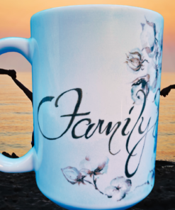 Family And Flowers Coffee Mug featured against a golden beach sunset with silhouettes of people holding hands beside the ocean.