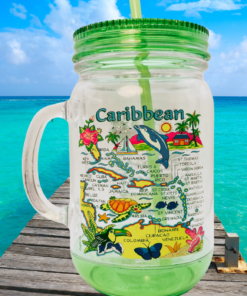 green caribbean islands mason jar tumbler on ocean dock with tropical beach background