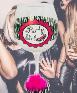 Party Girl zebra print wine glass in party setting with friends celebrating