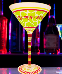 I Like Mine Dirty Martini Glass displayed in colorful cocktail bar setting