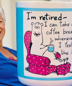 Hallmark Retired Coffee Break Mug displayed with smiling retired woman relaxing at home