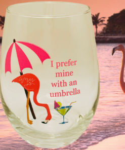 Flamingo umbrella wine glass styled on a beach with flamingo and sunset tropical background