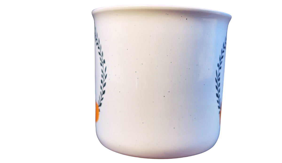 Cynthia Rowley Pumpkin Mug middle view showing the speckled off-white ceramic surface between the fall designs