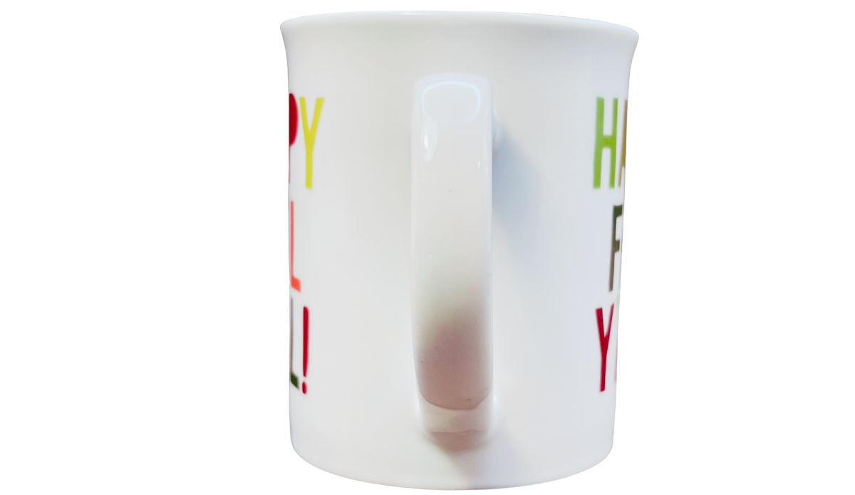 Happy Fall Y'all Mug handle view with broad white curved handle between the colorful decorated sides