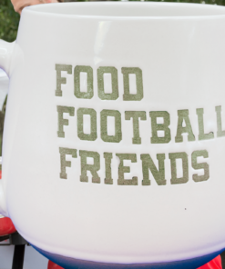 Food Football Friends Game Day mug displayed at a football tailgate gathering