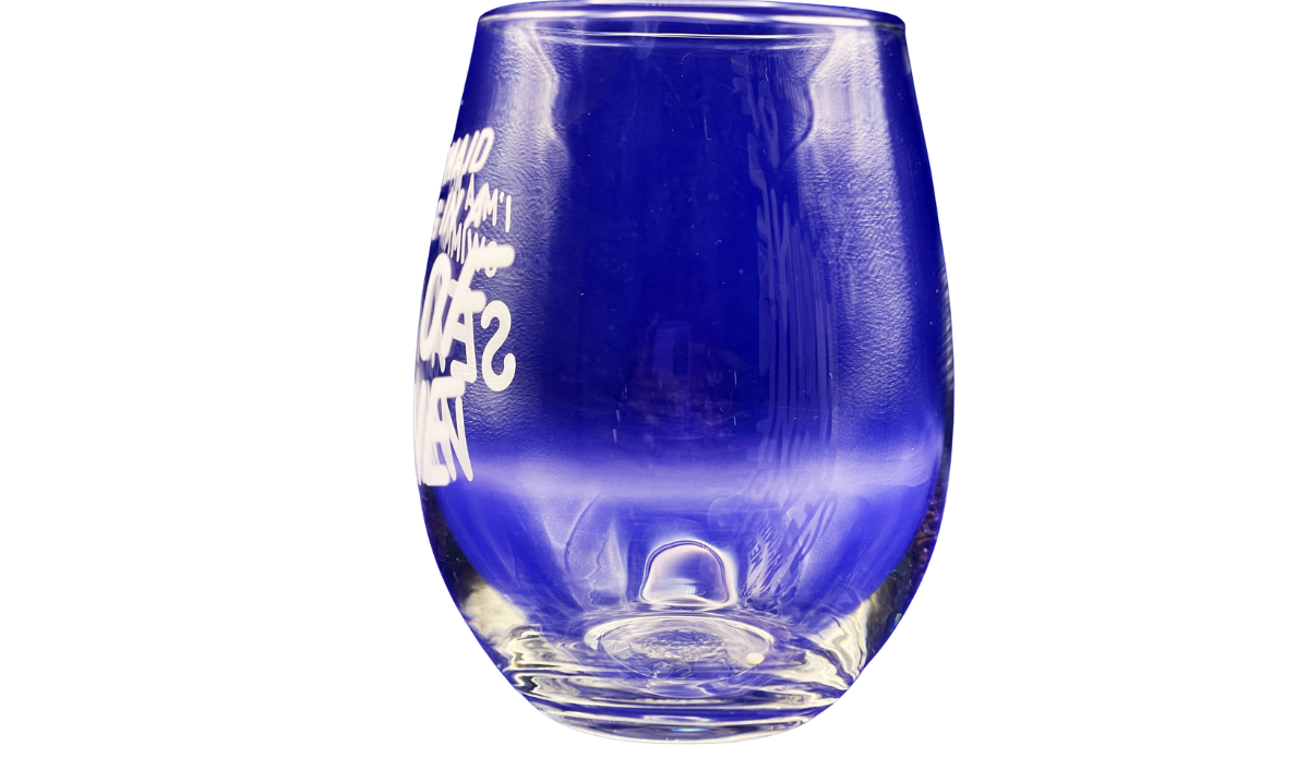 Left side view of clear Mermaid Sea Of Wine Stemless Wine Glass with partial white mermaid message