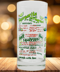 Margarita recipe bar glass on wooden table with warm bar background lighting