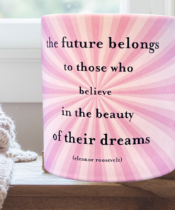 future belongs mug styled in cozy setting with soft blanket and natural light