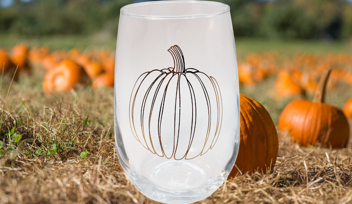 Jumbo Pumpkin Stemless Wine Glass in pumpkin patch fall lifestyle scene