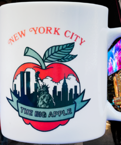 NYC Big Apple Mug displayed against Times Square New York City background
