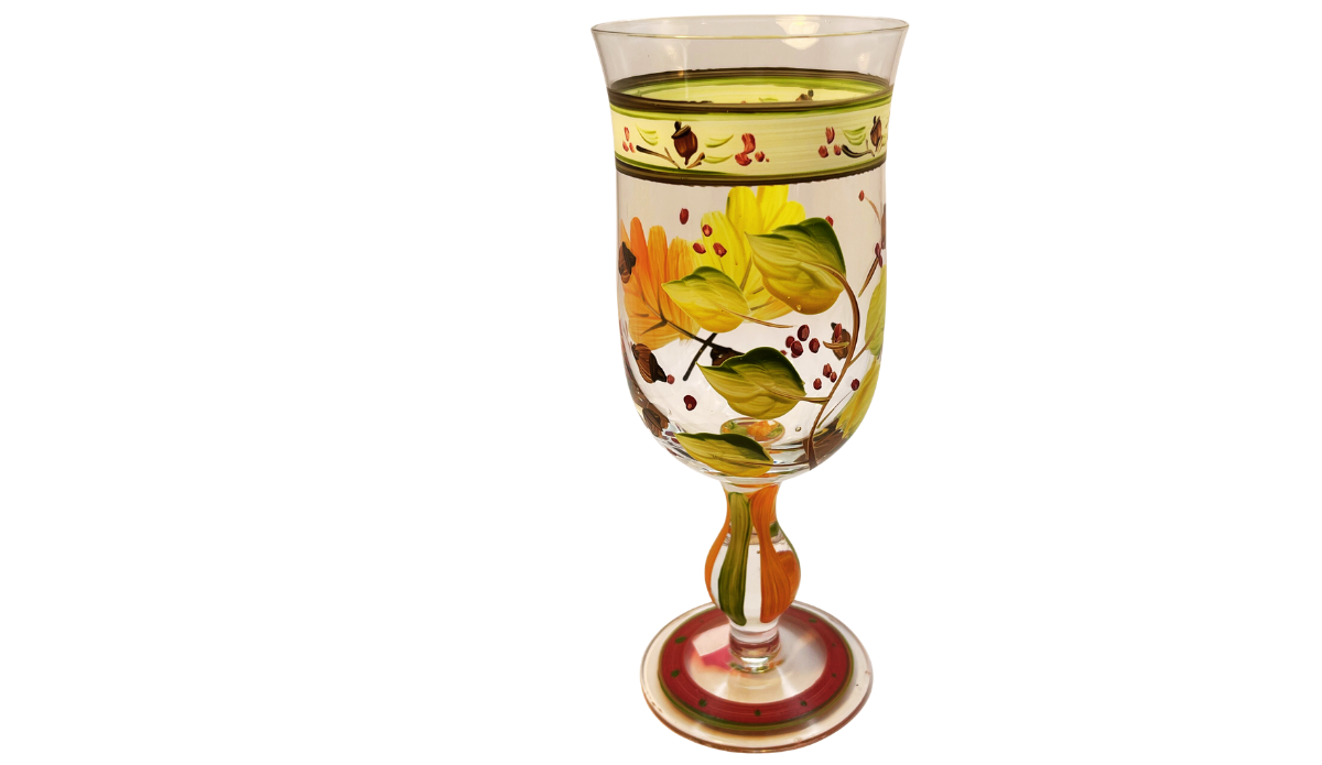 Autumn Leaves Wine Glass back angled view with layered green leaves, orange foliage, berries, and painted stem