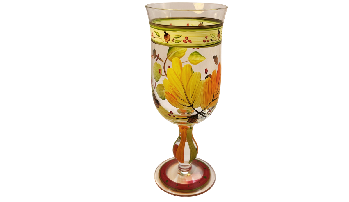 Autumn Leaves Wine Glass alternate side view with large yellow and orange leaves, green foliage, decorative border, painted stem, and base