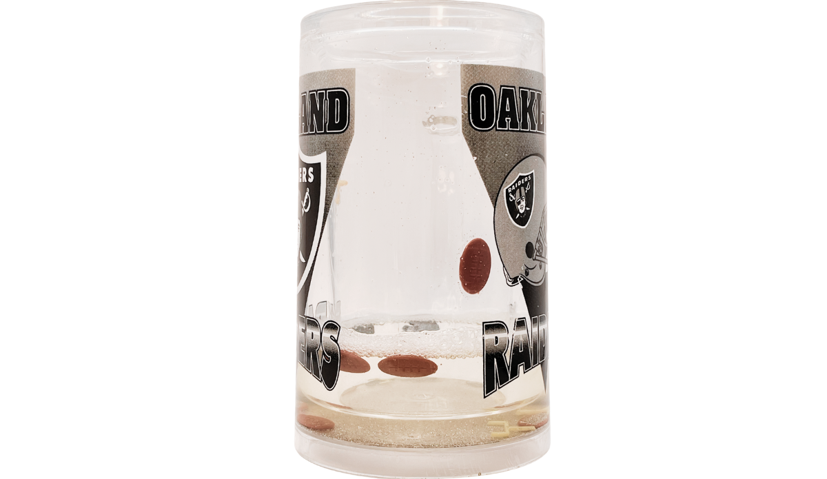 Side view of Oakland Raiders acrylic freezer mug with floating football and goalpost pieces