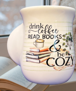 Coffee Books Cozy Handwarmer Mug styled with book and cozy blanket setting