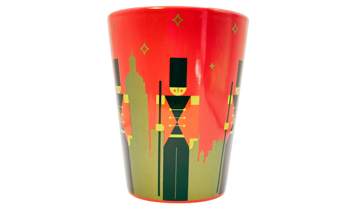 Side artwork on FAO Schwarz New York Toy Soldier Mug showing Empire State Building and toy soldiers